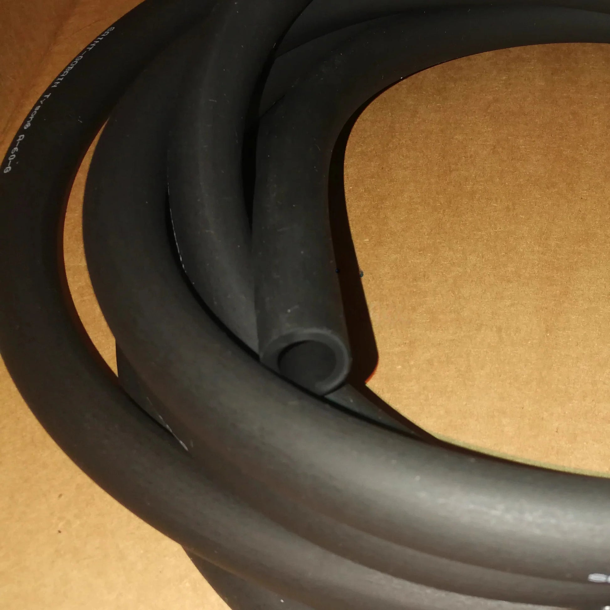 Tygon Norprene A-60-G black rubber tubing cross-section showing inner diameter, flexible peristaltic pump hose for ink transfer and chemical resistance

