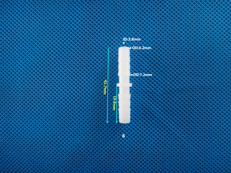 Miniature barb fitting for microfluidic chip and lab-on-chip systems
